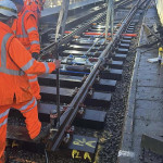 Cranes moving sections of a railway track