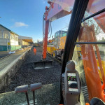 Excavator working at a railway platform