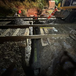 Groundmen constructing a railway track